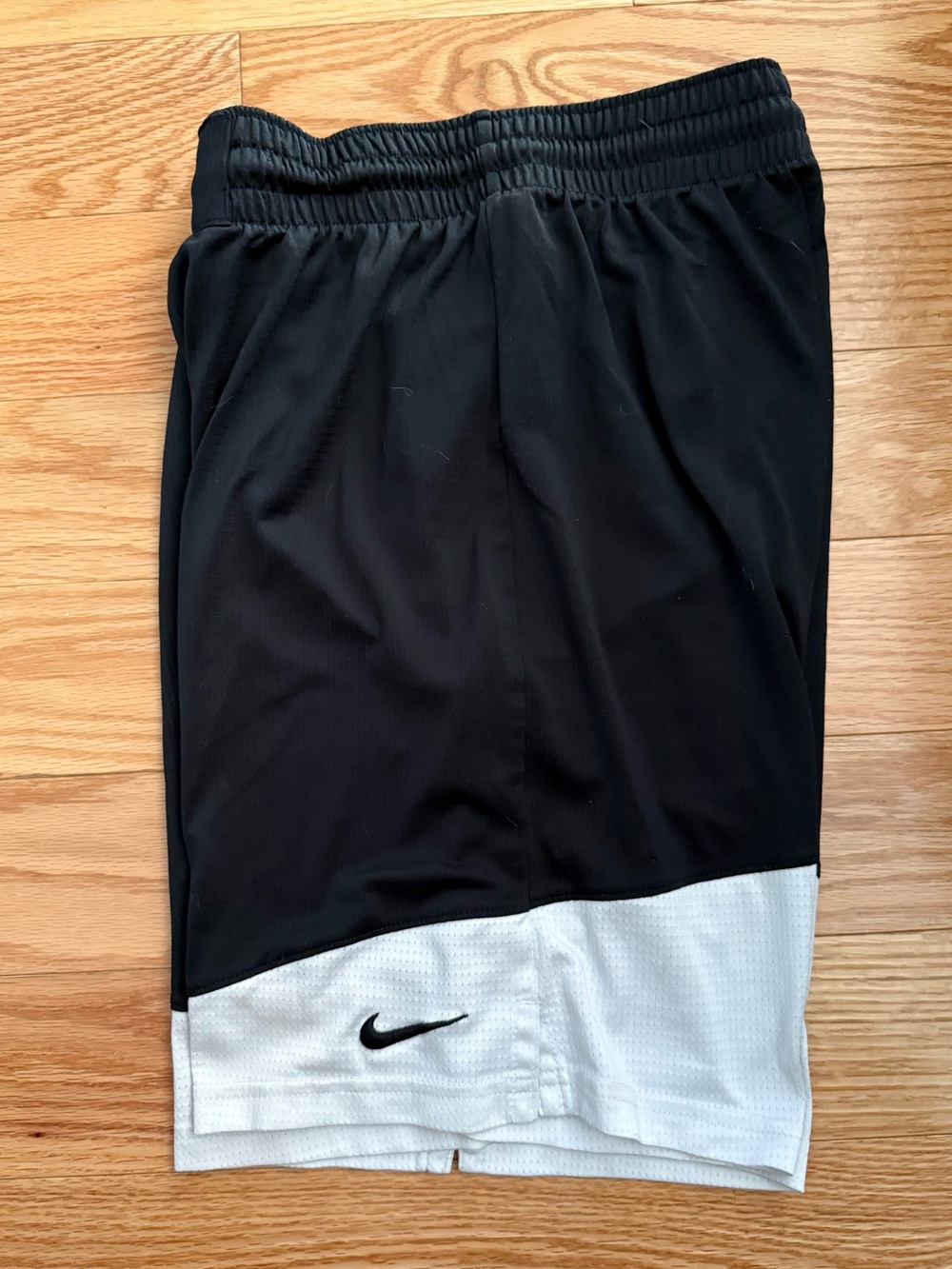 Nike black and white swoosh embroidered logo basketball uniform shorts